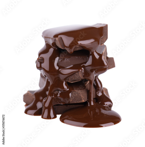 Chocolate pieces stack and chocolate syrup isolated on white background. Close up.