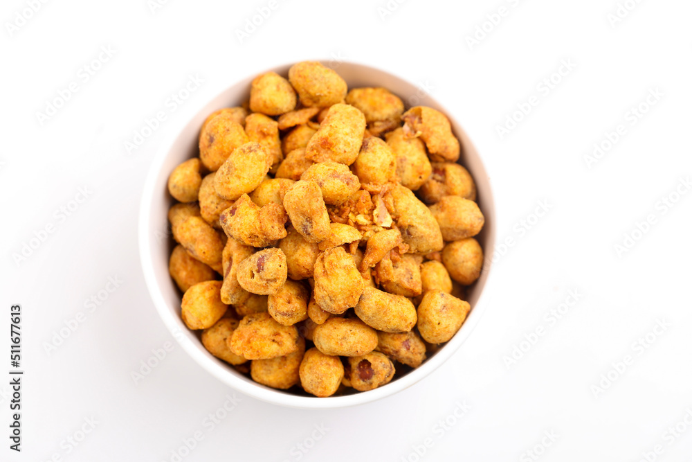 Roasted coated peanuts on white background. Delicious snack peanut. Roasted coated peanuts on white background. Delicious snack peanut.