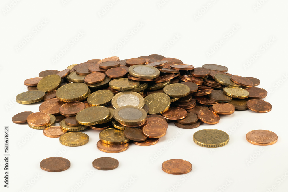 Pile of money coins isolated on bright background. Close up view. Pile of money coins isolated on bright background. Close up view.