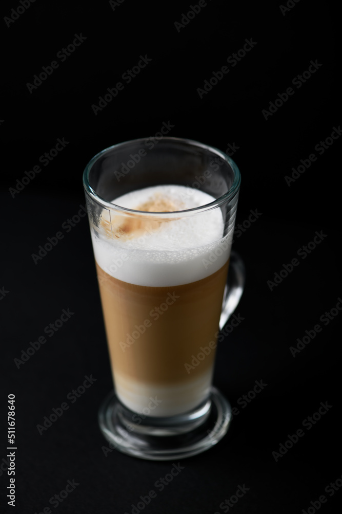 Coffee with milk on dark background. Close up. Copy space. Coffee with milk on dark background. Close up. Copy space.