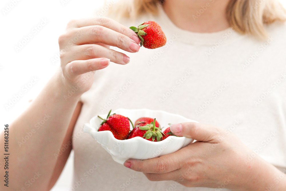 woman holding strawberries woman holding strawberries