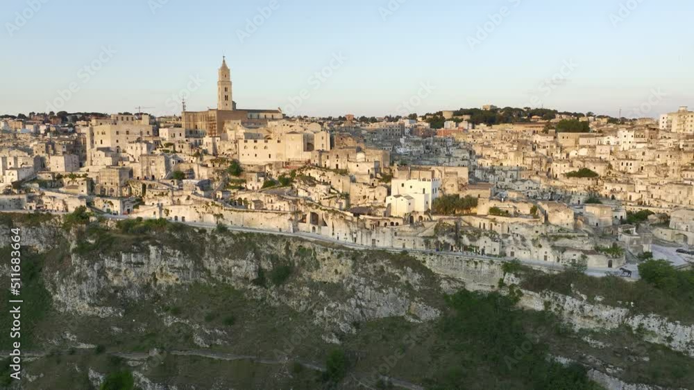 View from above, stunning aerial view of the Matera’s skyline during a beautiful sunrise. Matera is a city on a rocky outcrop in the region of Basilicata, in southern Italy. View from above, stunning aerial view of the Matera’s skyline during a beautiful sunrise. Matera is a city on a rocky outcrop in the region of Basilicata, in southern Italy.