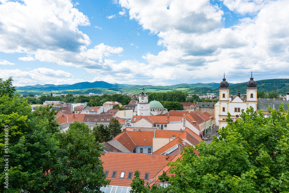 View of city Trencin, Slovakia. Beautiful town square with panoramic view to ancient Castle on the hill. Summer day with blue sky.