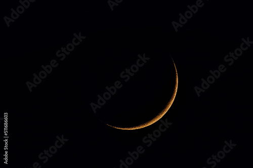 The crescent moon in the night in June over Germany