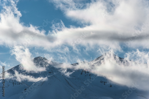 Snowy winter mountains in sun day. Georgia, from ski resort Gudauri. © irimeiff