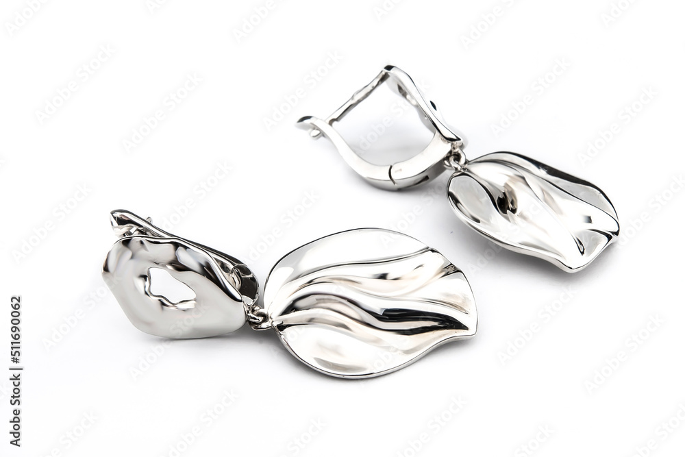 Luxury silver round earrings big jewelry for women isolated on white background, clipping path included Luxury silver round earrings big jewelry for women isolated on white background, clipping path included