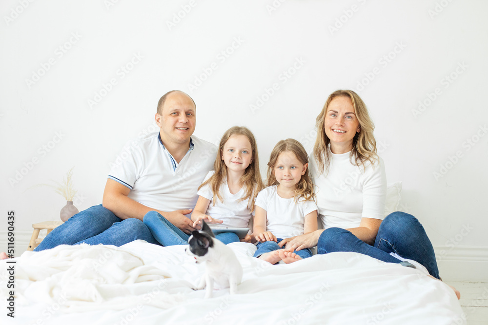 Happy family portrait. Two children daughters with mother and father. Mum, dad and girls smiling Happy family portrait. Two children daughters with mother and father. Mum, dad and girls smiling