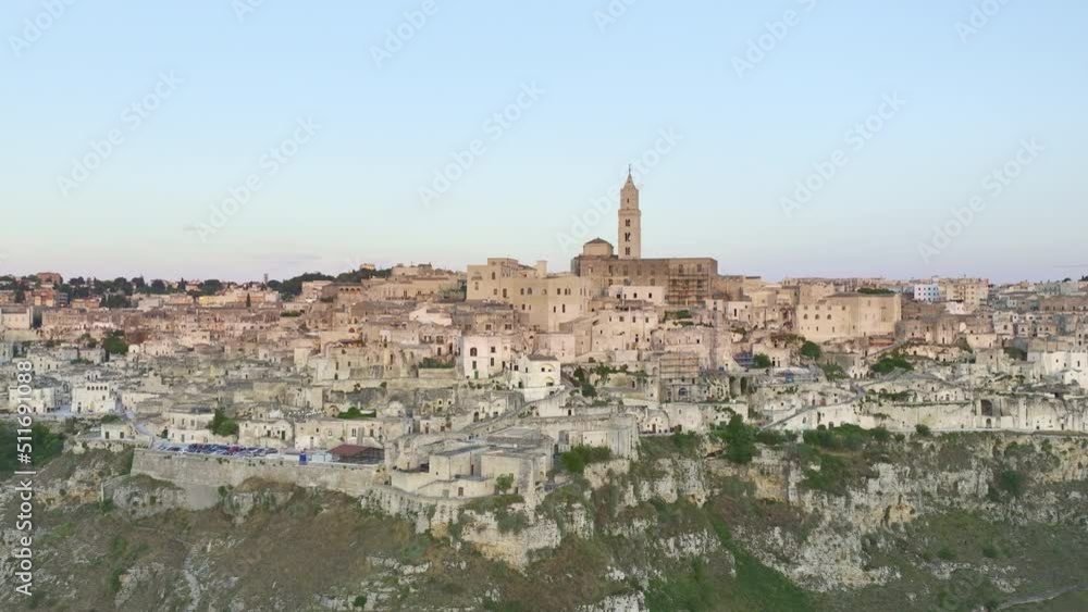 View from above, stunning aerial view of the Matera’s skyline during a beautiful sunrise. Matera is a city on a rocky outcrop in the region of Basilicata, in southern Italy. View from above, stunning aerial view of the Matera’s skyline during a beautiful sunrise. Matera is a city on a rocky outcrop in the region of Basilicata, in southern Italy.