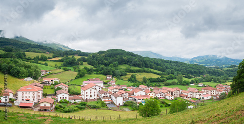 panoramic view of pyrenees mountains and countryside town, spain photo