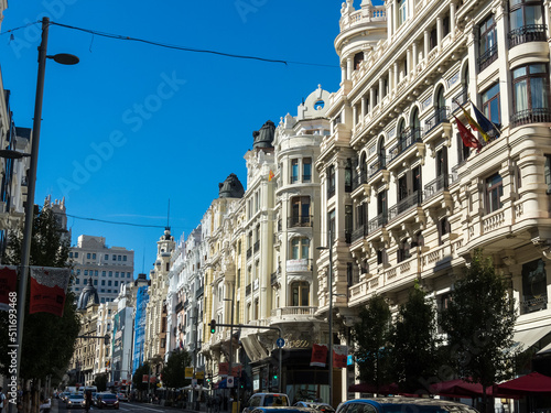 Panoramic view of Gran Vía street in Madrid with a blue sky with clouds