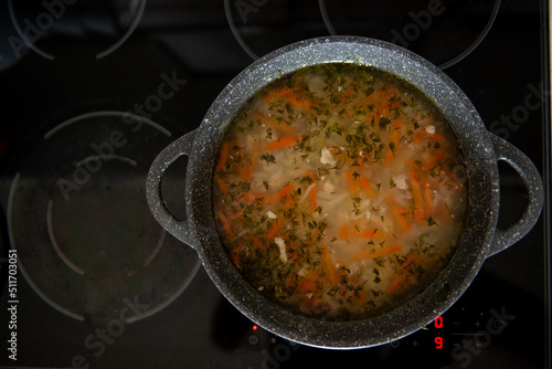 national soup in a cauldron on the stove