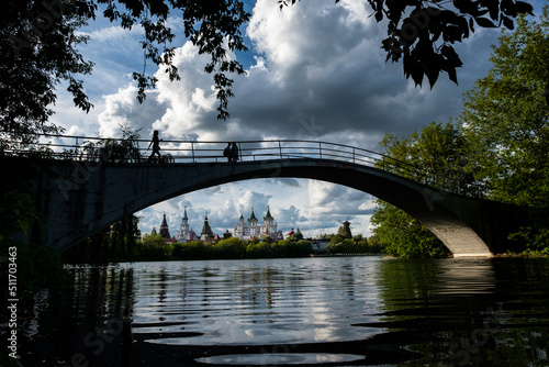 Fototapeta Naklejka Na Ścianę i Meble -  A beautiful view of the Kremlin Izmailovo through a silver-grape pond
