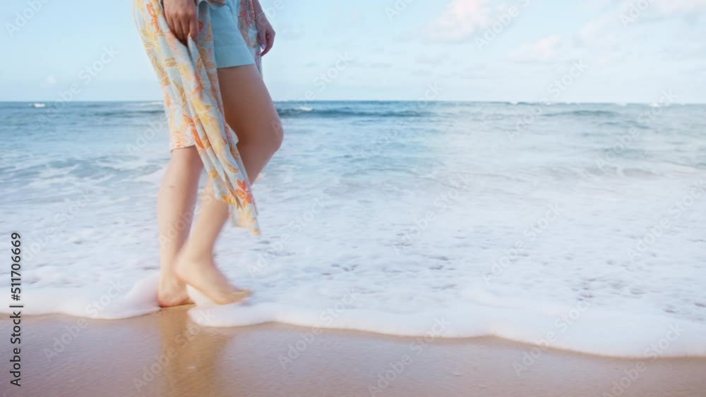 Close up injured women legs. Young woman show her injuries and bruises on legs after family abuse during psychotherapy outdoor session. Domestic violence victim feeling freedom and release at ocean
