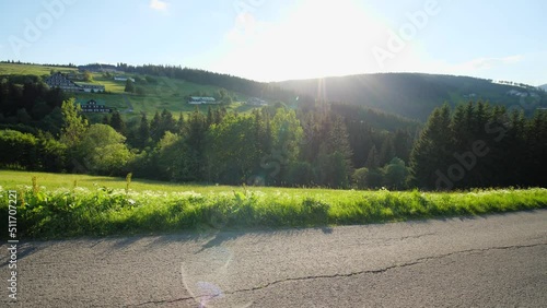 Landscape of Krkonose mountains in summer dotted with hotels and huts photo