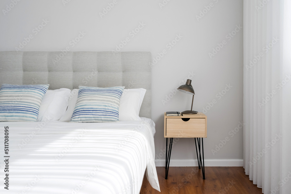 Fototapeta premium Minimalistic modern bedroom interior design with bedside table