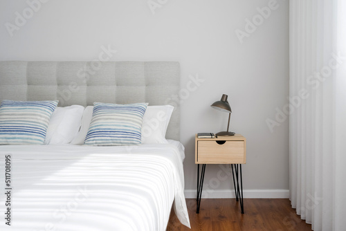 Minimalistic modern bedroom interior design with bedside table