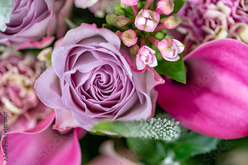 Hand tied exquisite bouquet features antiqua carnations  elegant Calla Lilies  Roses and fragrant Eucalyptus.