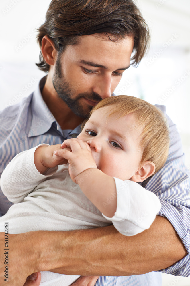 Hes my beautiful baby boy. Shot of a young father spending time with his baby boy. Hes my beautiful baby boy. Shot of a young father spending time with his baby boy.