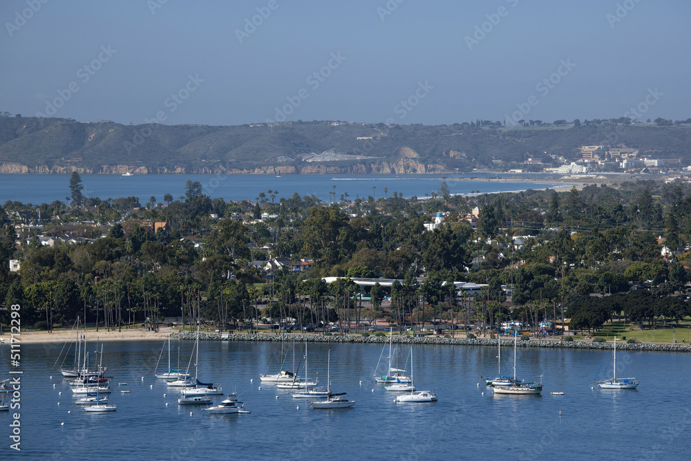 Sailboats moored in a bay
