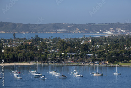 Sailboats moored in a bay