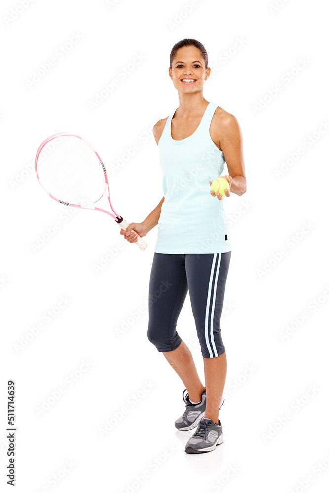 Ready to play. Full length portrait of a happy young woman ready for her match while holding a tennis racket and ball.