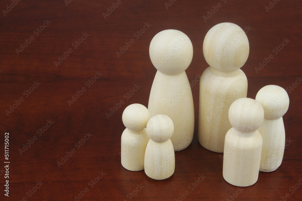 People figures as family members with copy space for text. Concept of classic traditional family, unity, togetherness and relationship. People figures as family members with copy space for text. Concept of classic traditional family, unity, togetherness and relationship.
