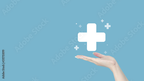Female hand holding plus icon on blue background, Positive thinking, Mental health assessment, World mental health day, Health insurance, Growth concepts 