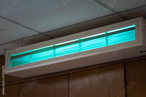 An UV lighting lamp using to cleaning and sterilizing bacteria in the air. Electrical equipment object photo.