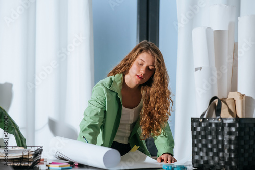 Portrait of young woman at her workplace in the home