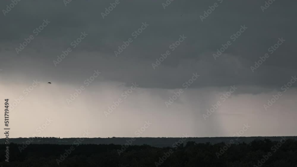 Lightning flash in storm clouds. Heavy clouds bring multiple flashes of
