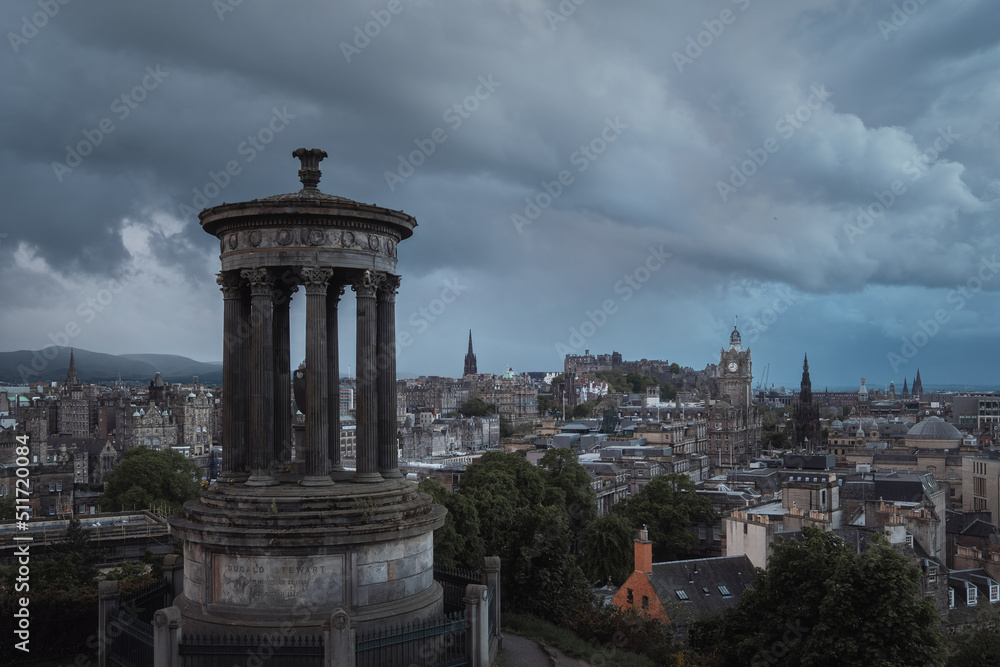 Top view of Edinburgh city centre in Scottish cloudy weather. Cityscape of the monument to Dugald Stewart, Edinburgh, Scotland, United Kingdom