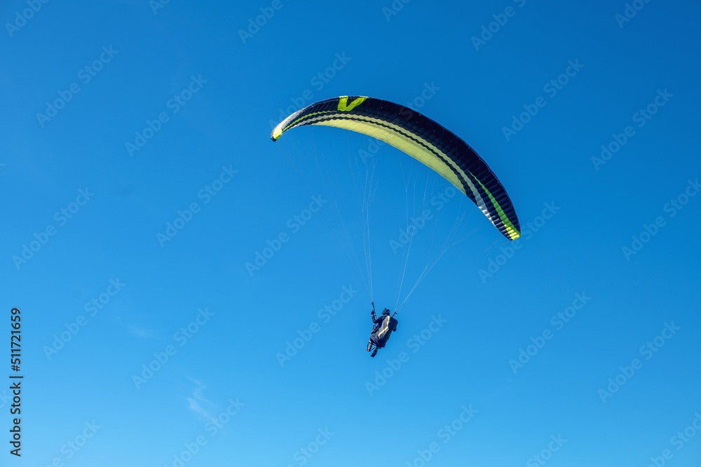 The sportsman flying on a paraglider. Silhouette on blue sky.
Paragliding take off. Travel destination. Summer and holiday concept. The sportsman flying on a paraglider. Silhouette on blue sky.
Paragliding take off. Travel destination. Summer and holiday concept.