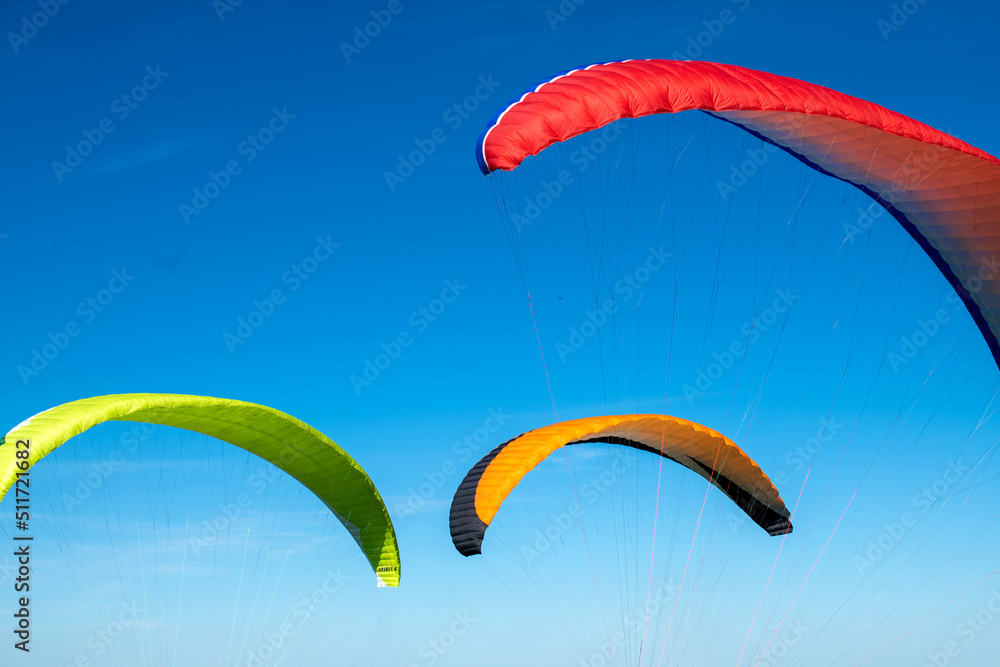 The sportsman flying on a paraglider. Silhouette on blue sky.
Paragliding take off. Travel destination. Summer and holiday concept. The sportsman flying on a paraglider. Silhouette on blue sky.
Paragliding take off. Travel destination. Summer and holiday concept.