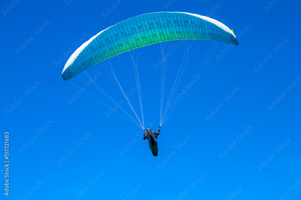 The sportsman flying on a paraglider. Silhouette on blue sky.
Paragliding take off. Travel destination. Summer and holiday concept. The sportsman flying on a paraglider. Silhouette on blue sky.
Paragliding take off. Travel destination. Summer and holiday concept.