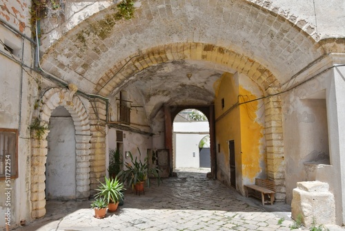 A narrow street between the old houses of Galatina  an old village in the province of Lecce in Italy.