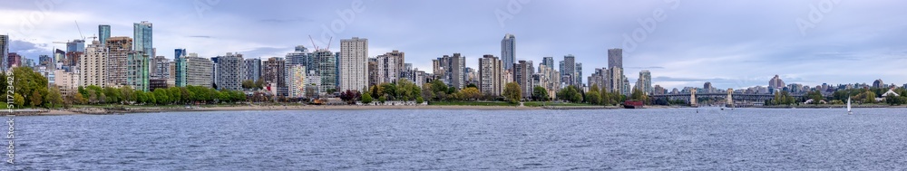 Modern City, Stanley Park, Buildings, beach and Burrard Bridge in False Creek on the West Coast of Pacific Ocean. Downtown Vancouver, British Columbia, Canada. Panoramic View