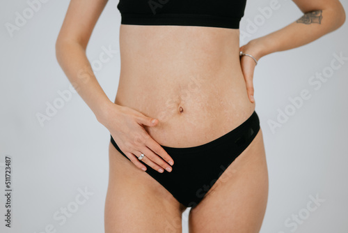 Plus size body positive brunette woman wearing comfortable underwear © teksomolika