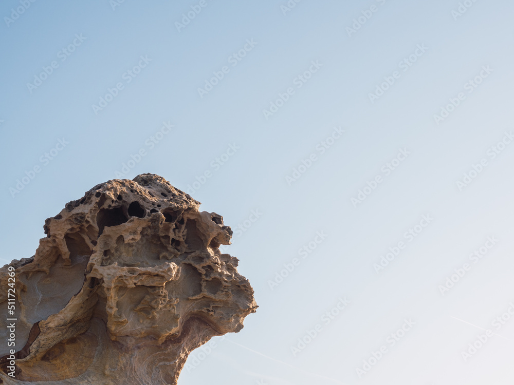 Weathered rock with copy space and clear sky. geology concept