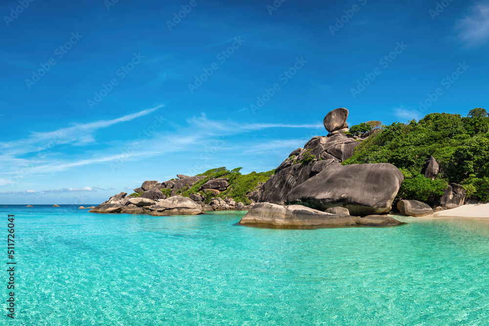 Tropical islands of ocean blue sea water and white sand beach at Similan Islands with famous Sail Rock, Phang Nga Thailand nature landscape