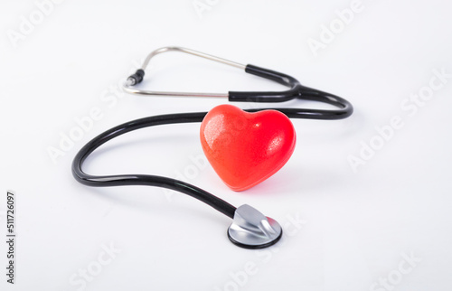 stethoscope and heart on blue background