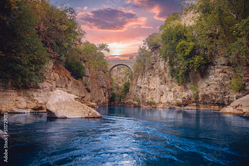 Ancient arch bridge Oluk over Koprucay river Tazi Canyon in Manavgat Antalya Turkey sunset photo