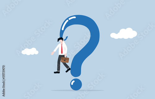 Stucking on unanswered question, unable to solve 
business or career working problem, stress and empty brain concept. Miserable businessman attaching to question mark sign hook. 