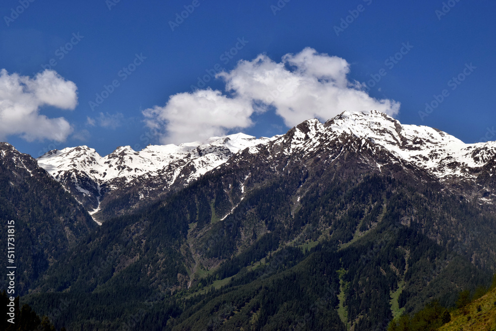 snow covered mountains and clouds snow covered mountains and clouds