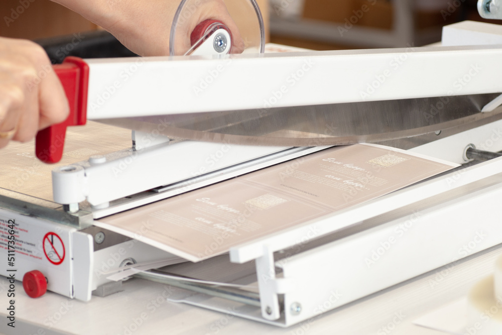 close-up manual guillotine knife blade for paper cuts laminated leaflet, flyers. close-up manual guillotine knife blade for paper cuts laminated leaflet, flyers.