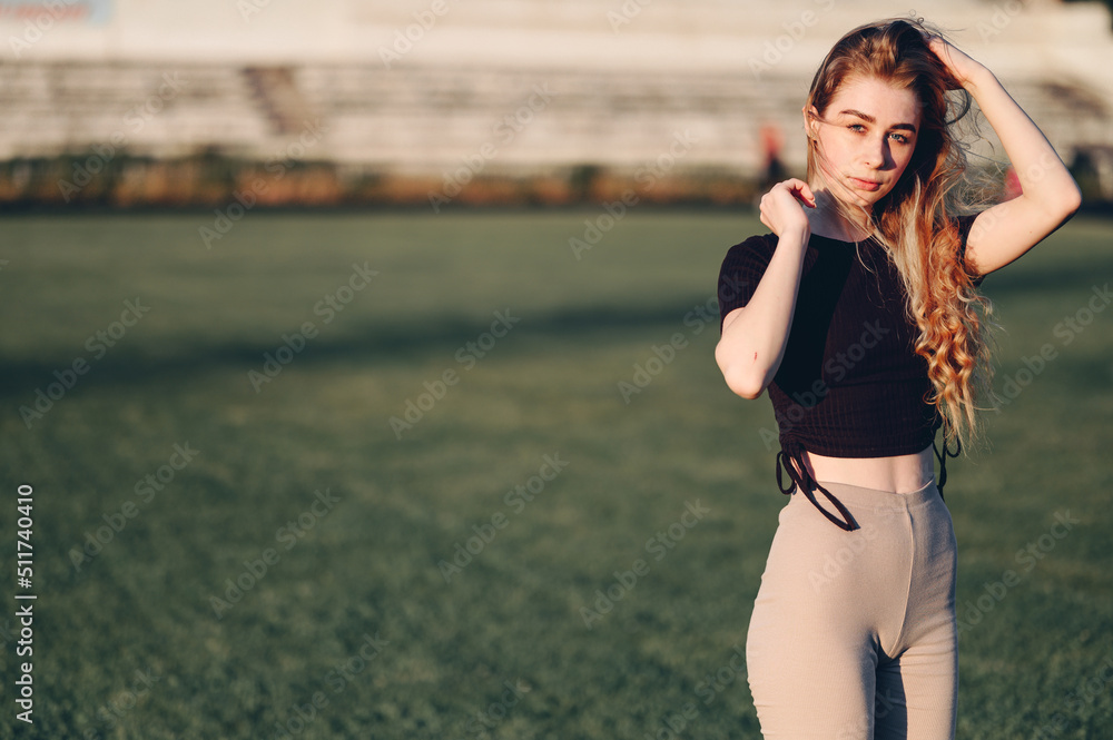 Portrait of a Young Woman in Sportswear. Go in for sports After classes In the evening. Portrait of a Young Woman in Sportswear. Go in for sports After classes In the evening.