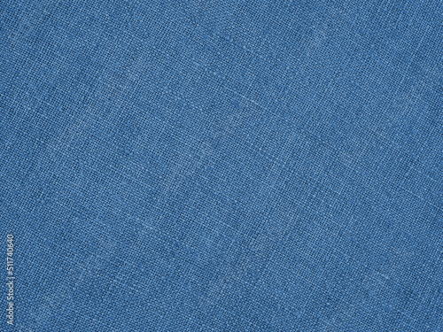 Blue woven surface closeup. Linen textile texture. Graceful color fabric background. Textured braided backdrop. Macro