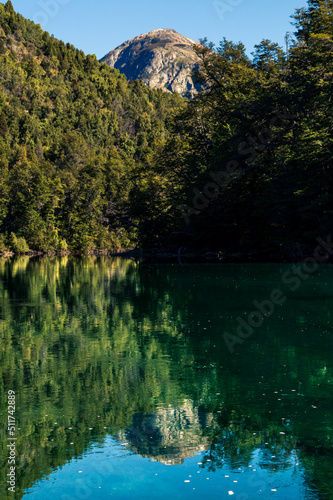 Obraz na płótnie Mountain peak and forest with a calm turquoise lake reflecting. Arrayanes River, Los Alerces National Park. Vertical w salonie