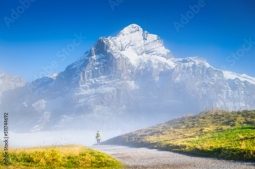 Tourist with a backpack in the mountains. Mountain hiking in the high mountai...