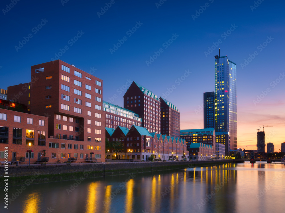 Rotterdam, Netherlands. View of the city center. Cove and pier for boats and ships. Panoramic view. Cityscape in the evening. Skyscrapers and buildings. - obrazy, fototapety, plakaty 