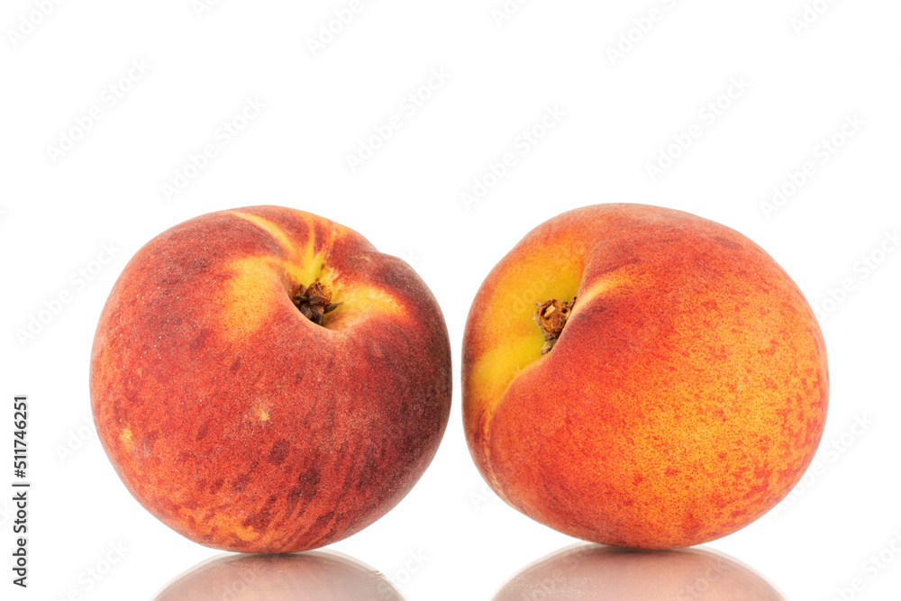 Two sweet organic peaches, close-up, isolated on white background. Two sweet organic peaches, close-up, isolated on white background.